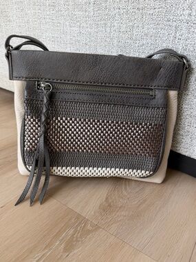 The Sak Woven Accent Crossbody Bag in charcoal grey and Cream